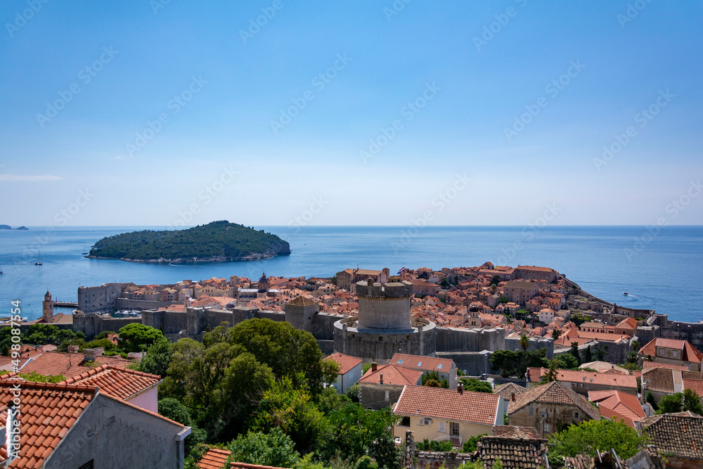 View of the old town of Dubrovnik from up hill in a sunny summer day
