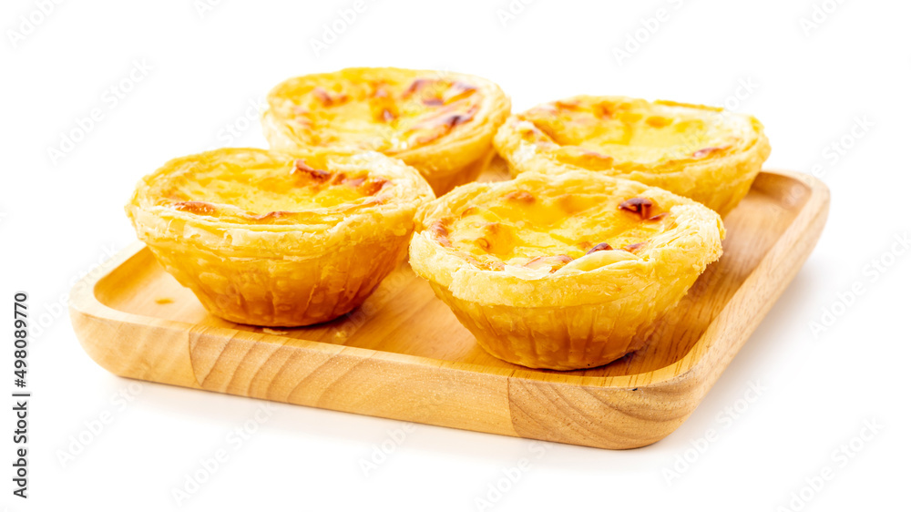 Egg tart on wooden plate isolated on white background Egg tart on wooden plate isolated on white background