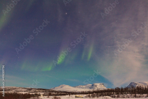 Abisko, Aurora Borealis in Lapland. Sweden lights in the sky full of stars. Land of the Sami people. Solar wind colors