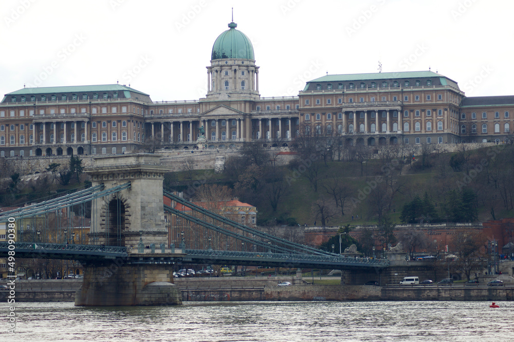 BUDAPEST, HUNGARY - 03 MAR 2019: The Royal Palace, site of the Hungarian National Gallery. Chain Bridge in the foreground