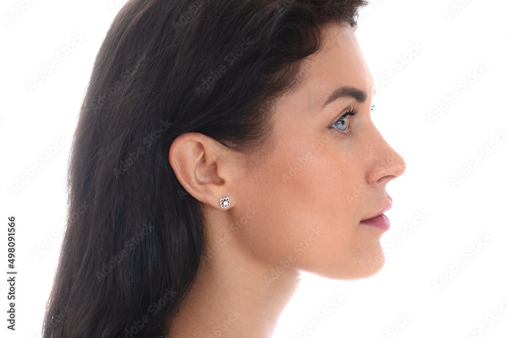 Profile portrait of an attractive woman against a white background Profile portrait of an attractive woman against a white background