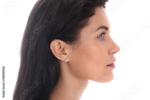 Profile portrait of an attractive woman against a white background
