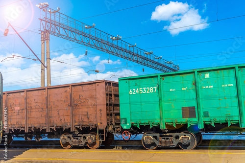 Railway freight wagons, freight train, taken in backlit and sun glare..