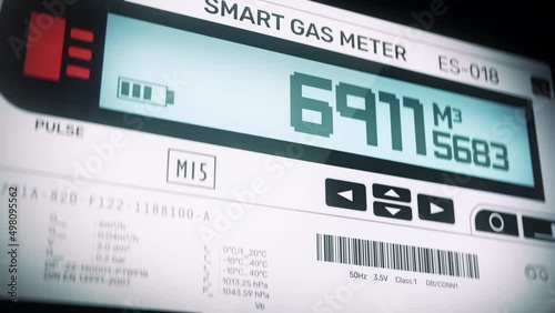 Smart gas meter display showing volume of cubic metres consumed by residence. Digital metric gas meter measuring gas usage photo