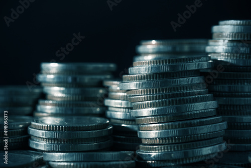 Coins money stack in finance treasury deposit bank account saving, corporate business economy and financial growth by investment in valuable asset to gain cash revenue. Forex trading economy.