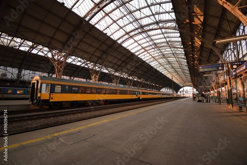 Prague, Czechia - February 27, 2022: orange train of Regiojet company in main train station of Prague