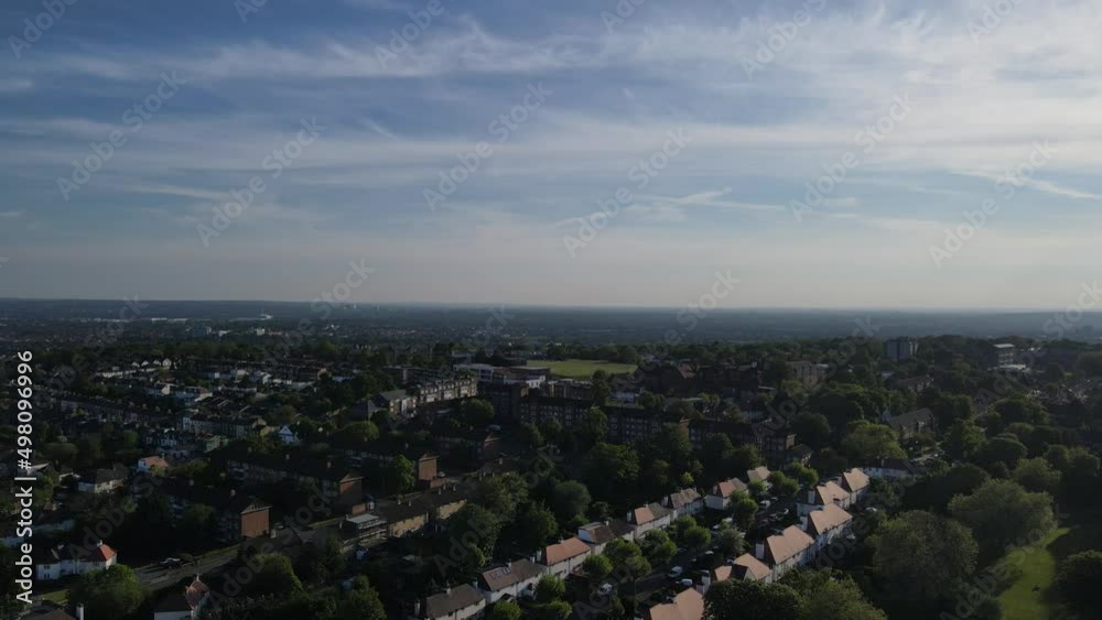Panoramic short sweep over London city with blue skies and trees. Aerial drone footage Panoramic short sweep over London city with blue skies and trees. Aerial drone footage