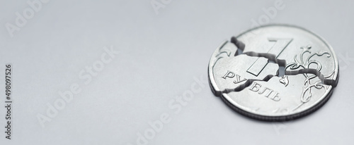 Close up broken russian ruble with empty horizontal spase for advertising banner
