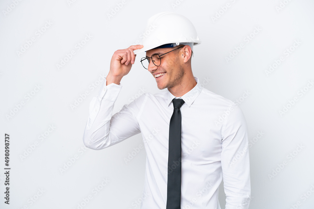 Young architect caucasian man with helmet and holding blueprints isolated on white background laughing Young architect caucasian man with helmet and holding blueprints isolated on white background laughing