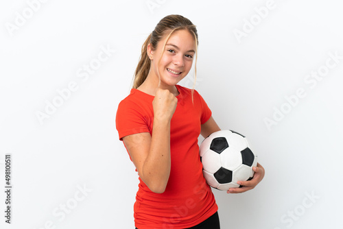 Fototapeta Naklejka Na Ścianę i Meble -  Little caucasian girl isolated on white background with soccer ball celebrating a victory