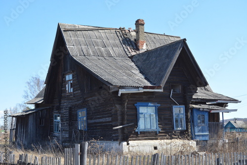 Old wooden two-storey apartment building in the village of Bolon , Khabarovsk Krai photo