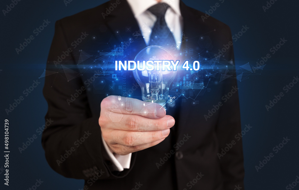 Businessman holding a light bulb Businessman holding a light bulb