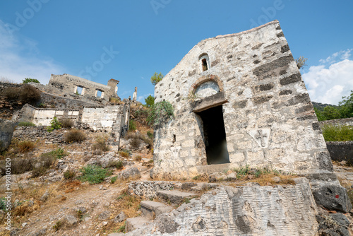 Kayak  y Abandoned ghost town  stone houses and ruins. The site of the 18th-century Ancient Greek city of Karmilissos. Ancient church. Fethiye - TURKEY