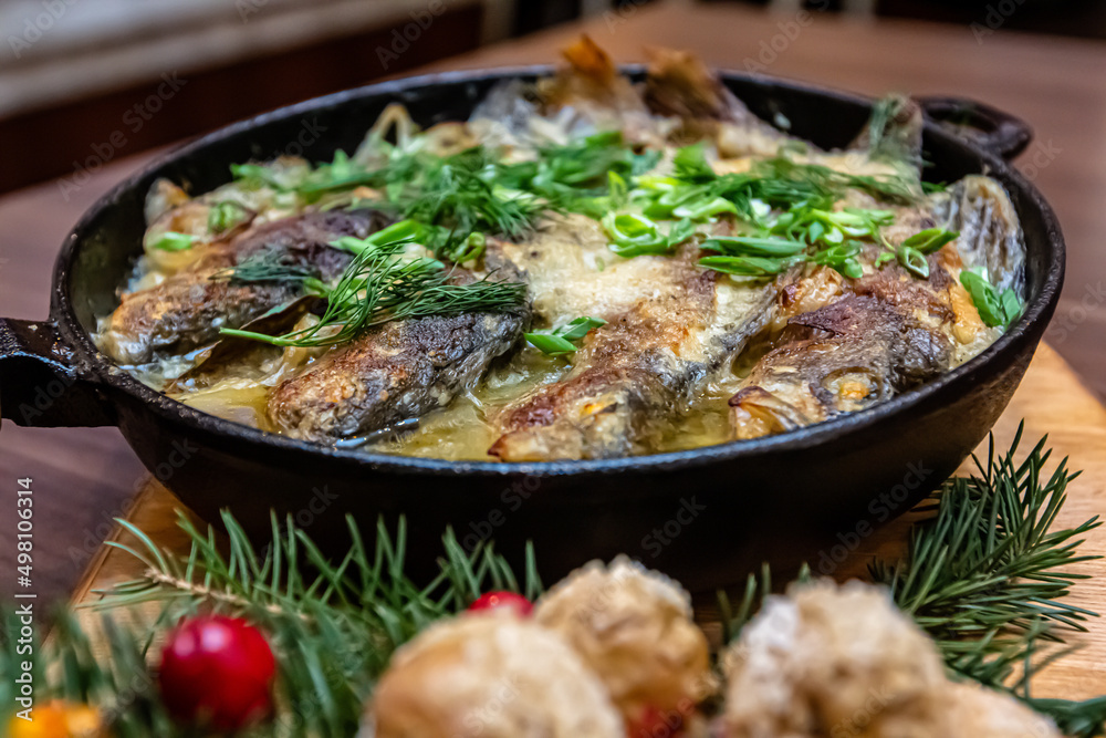 Fish baked in sour cream in a frying pan Fish baked in sour cream in a frying pan