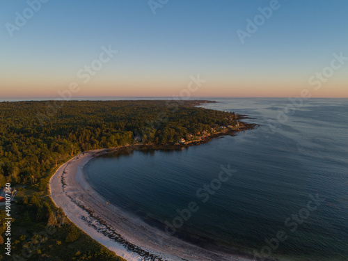 Sunrise on a coastal beach cove