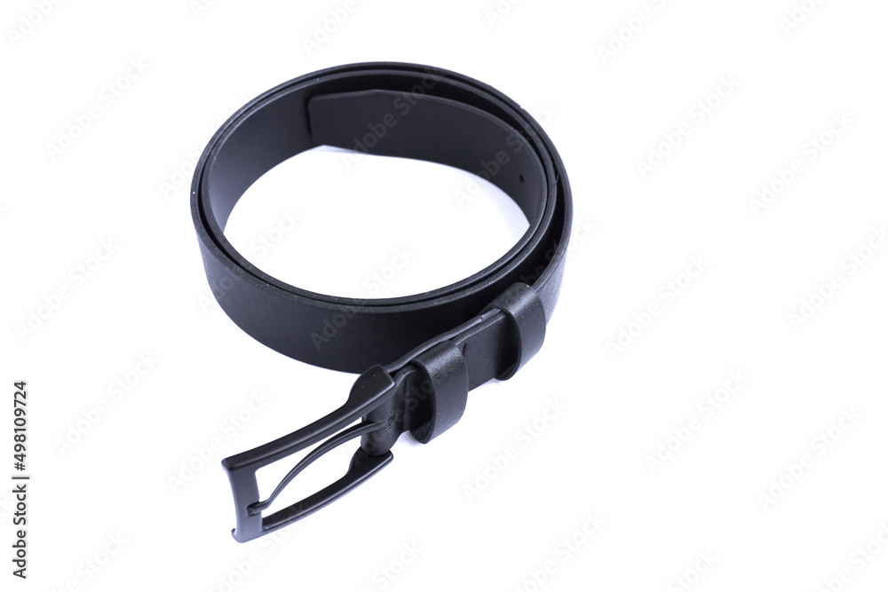 Curved black leather belt on a white background. Curved black leather belt on a white background.