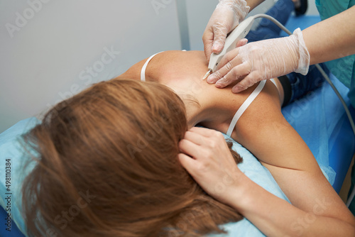 Woman having carboxytherapy procedure in medical center photo