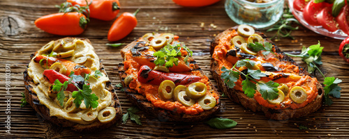 Tableau sur toile Sandwiches from toasted traditional sourdough bread with hummus, grilled peppers