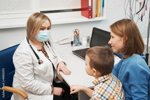 Woman and little boy having appointment with pediatrician