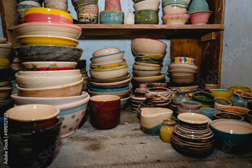 Hand made ceramic tableware  Collection of colorful clay pottery ceramics. Handicraft and art concept.