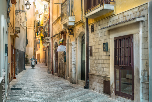 Fototapeta Naklejka Na Ścianę i Meble -  Typical Italian narrow street in old town Bari, depth of field effect, Puglia (Apulia), southern Italy