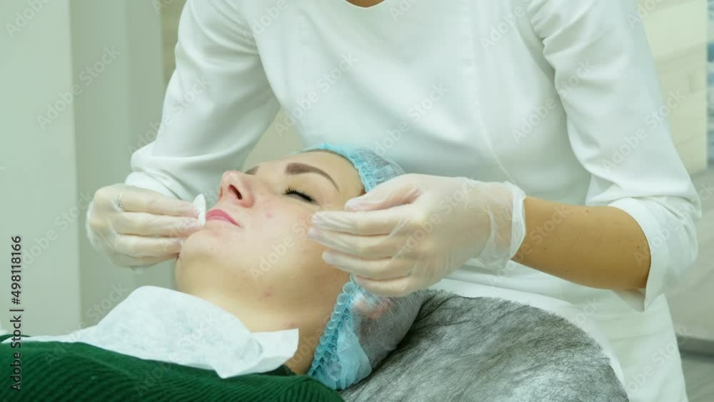 Cosmetologist treats a woman's lips before surgery and procedure Cosmetologist treats a woman's lips before surgery and procedure