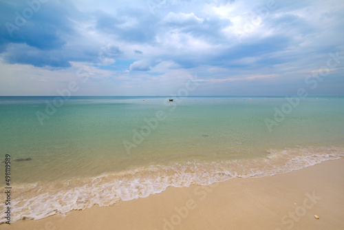 Empty exotic tropical beach with beautiful clouds. Relaxing sea view