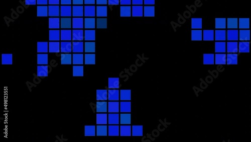 Black background.Design.Blue and yellow squares in abstraction run over a black background like tetris. photo