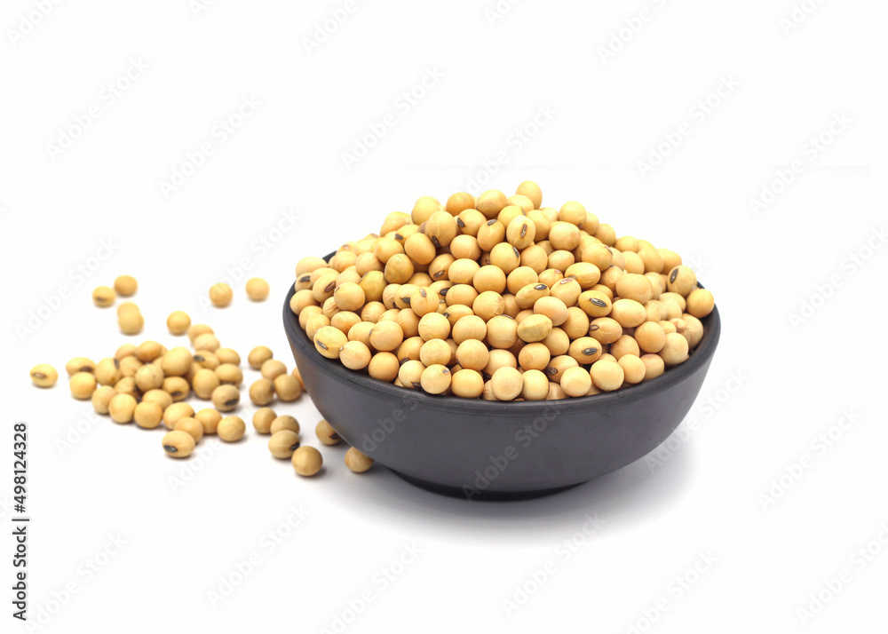 soybean seeds in a wooden bowl isolated on white background soybean seeds in a wooden bowl isolated on white background
