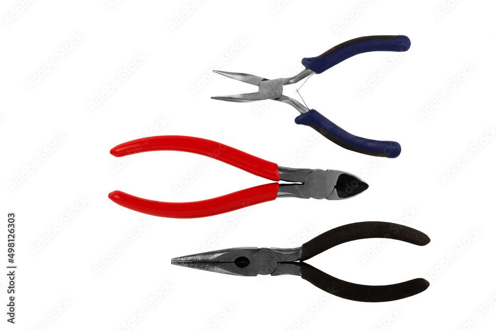 Cutter and plier tools disposed by diagonal, isolated on white background. Cut out. Cutter and plier tools disposed by diagonal, isolated on white background. Cut out.