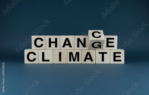 Cubes form the words Climate chance or change. Business and climate change concept.
