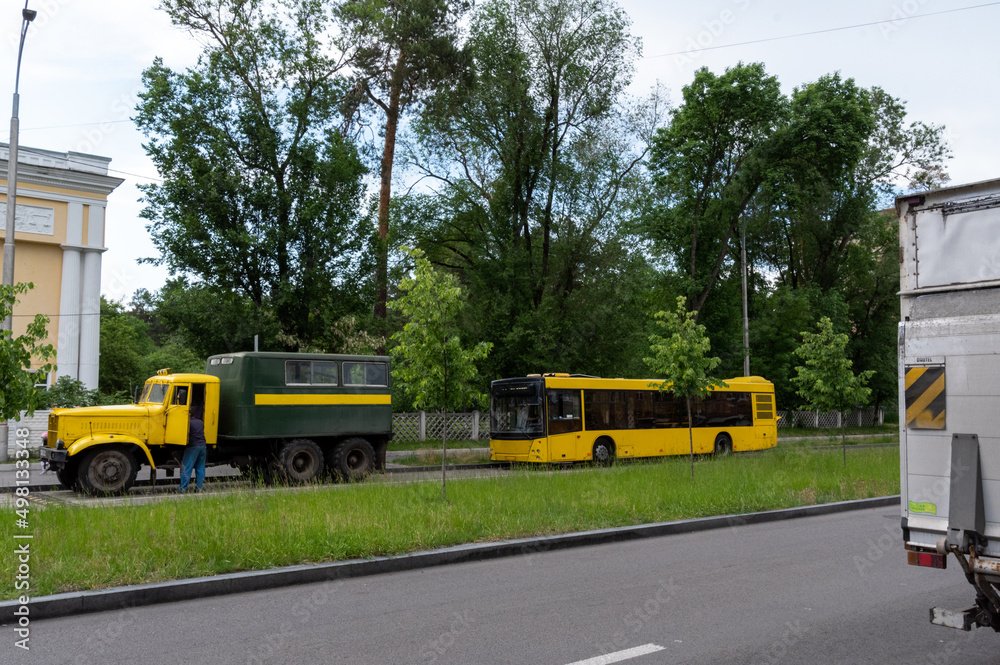 Obraz premium Bus technical assistance. The truck pulls the bus. Assistance to passenger transport.
