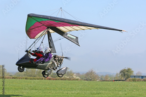	
Ultralight airplane taking off from a farm strip	 photo