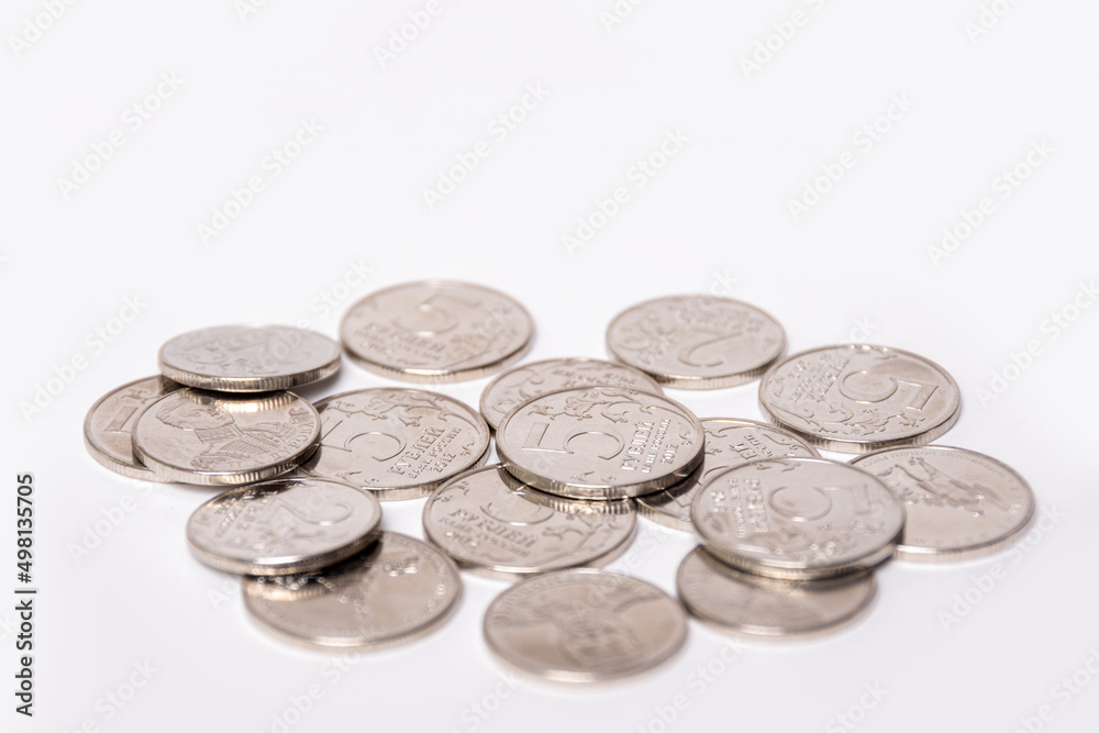 Background of coins of Russian rubles in denominations of 2 rubles, 5 rubles, copy space. The ruble is the national currency of Russia. Money concept. Background of coins of Russian rubles in denominations of 2 rubles, 5 rubles, copy space. The ruble is the national currency of Russia. Money concept.