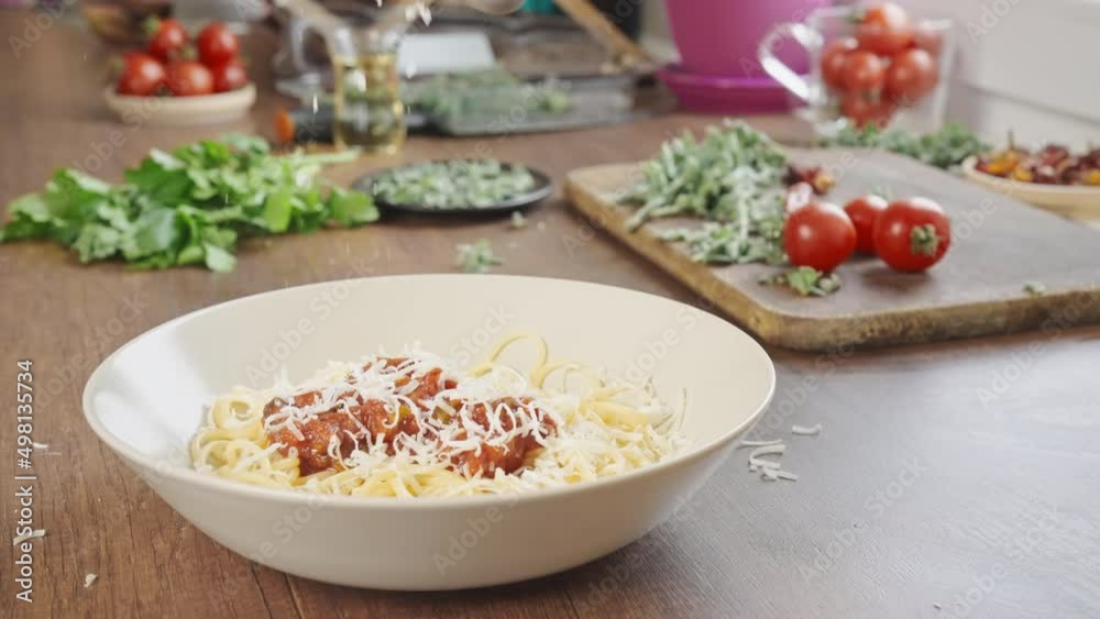 cooking and serving pasta with parmesan and marinara or tomato sauce italian dinner at home slow motion shot cooking and serving pasta with parmesan and marinara or tomato sauce italian dinner at home slow motion shot