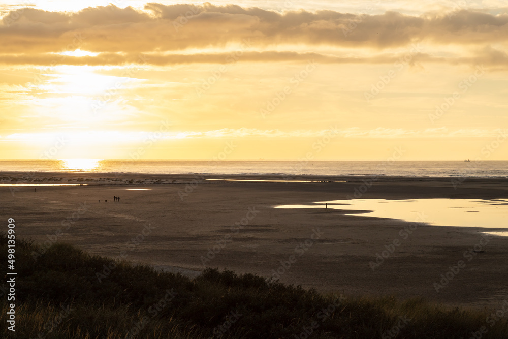 Sunset at the long beach on the Dutch island of Texel. Sunset at the long beach on the Dutch island of Texel.
