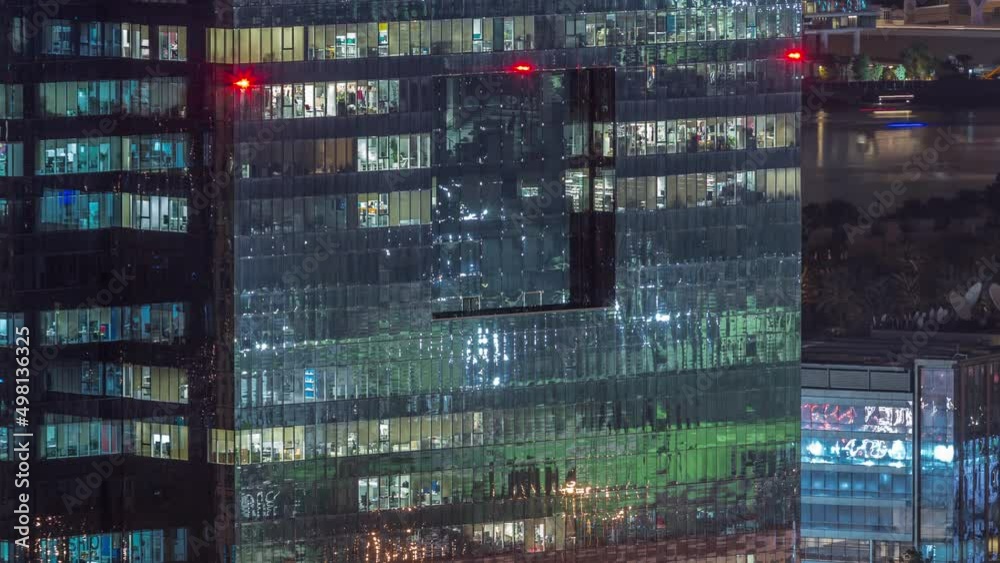 Windows in high-rise building exterior in the late evening with interior lights on timelapse Windows in high-rise building exterior in the late evening with interior lights on timelapse