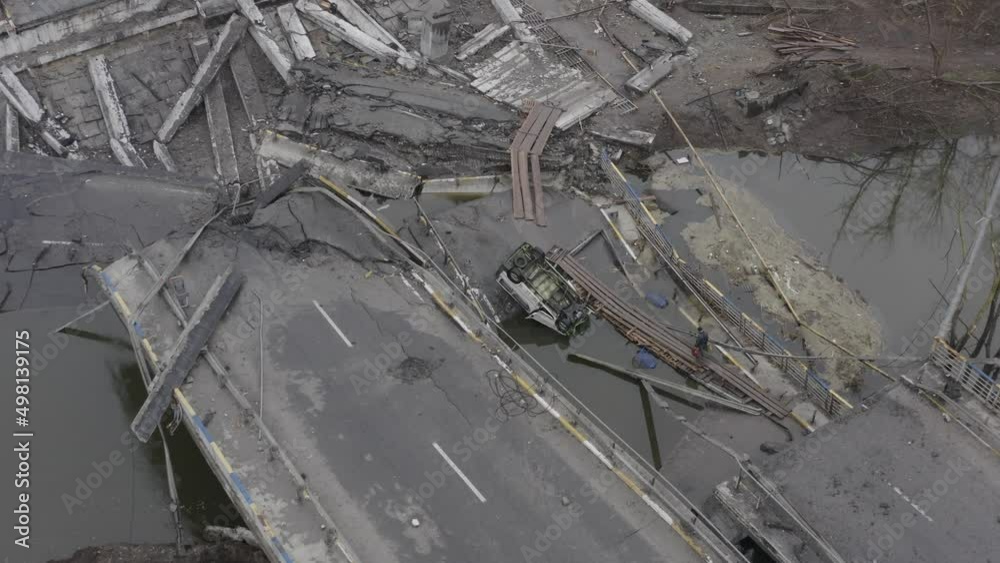 Post-apocalypse. Destroyed bridge with burnt cars. War. Ukraine. Irpin. Aerial Post-apocalypse. Destroyed bridge with burnt cars. War. Ukraine. Irpin. Aerial