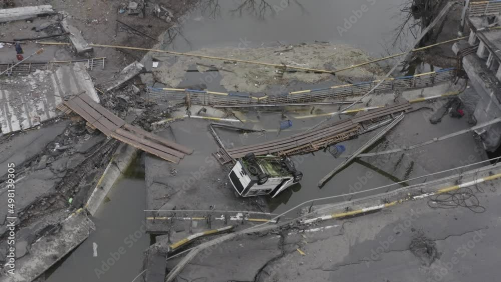Post-apocalypse. Destroyed bridge with burnt cars. War. Ukraine. Irpin. Aerial Post-apocalypse. Destroyed bridge with burnt cars. War. Ukraine. Irpin. Aerial