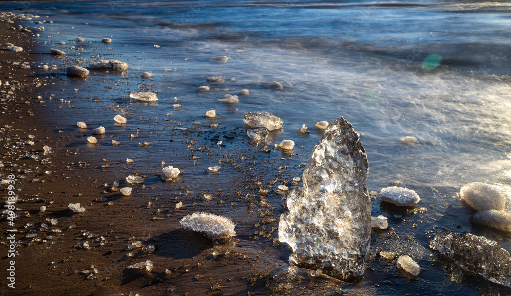 Close-up of piece of ice on snowy beach of Baltic sea at winter. Close-up of piece of ice on snowy beach of Baltic sea at winter.