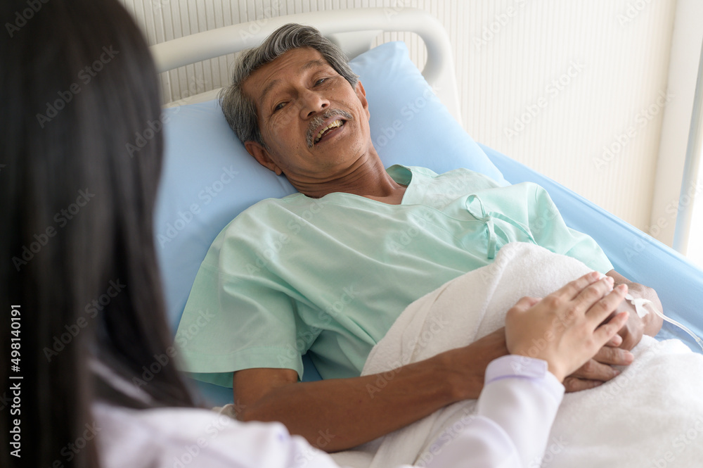 Doctor holding senior patient's hand in hospital, health care and medical concept.. Doctor holding senior patient's hand in hospital, health care and medical concept..