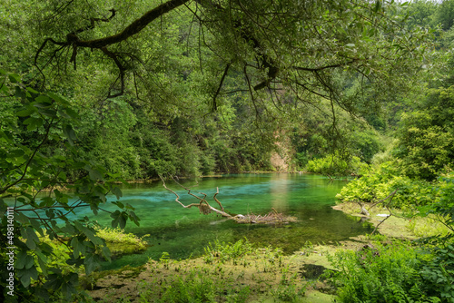 Beautiful turquoise spring Blue Eye or Syri i Kalter near Muzine town in Albania