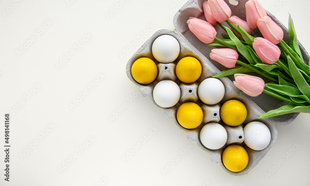 painted yellow Easter eggs on yellow background	
