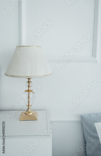 bedside table with a lamp