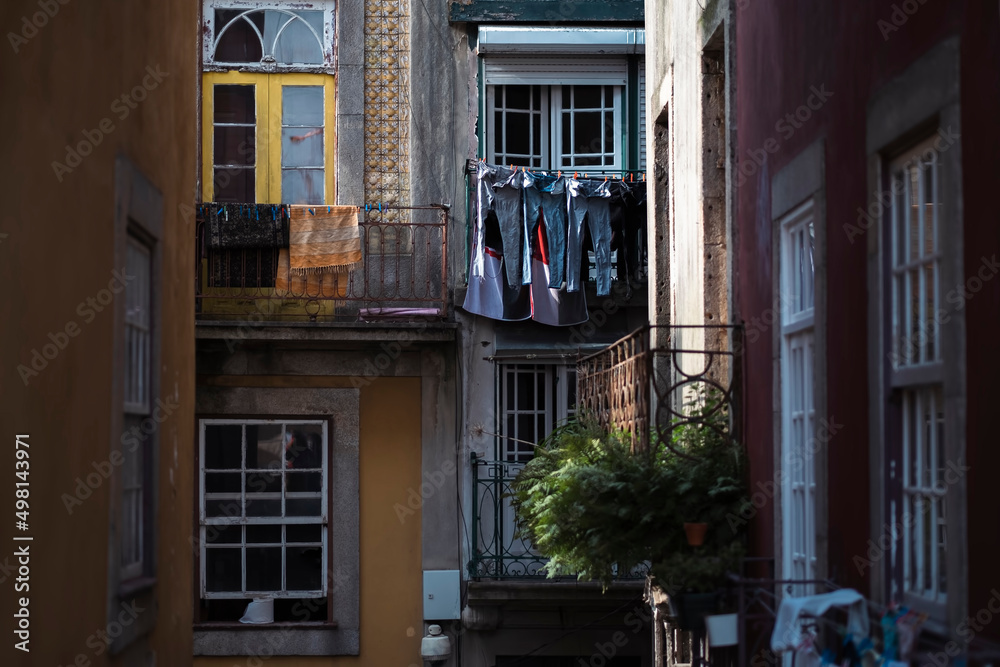 A view of the facade of a residential building in the historic center of Porto, Portugal.