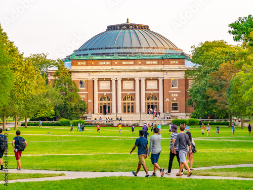 Canvastavla College students walk on the quad lawn of the University of Illinois campus in U