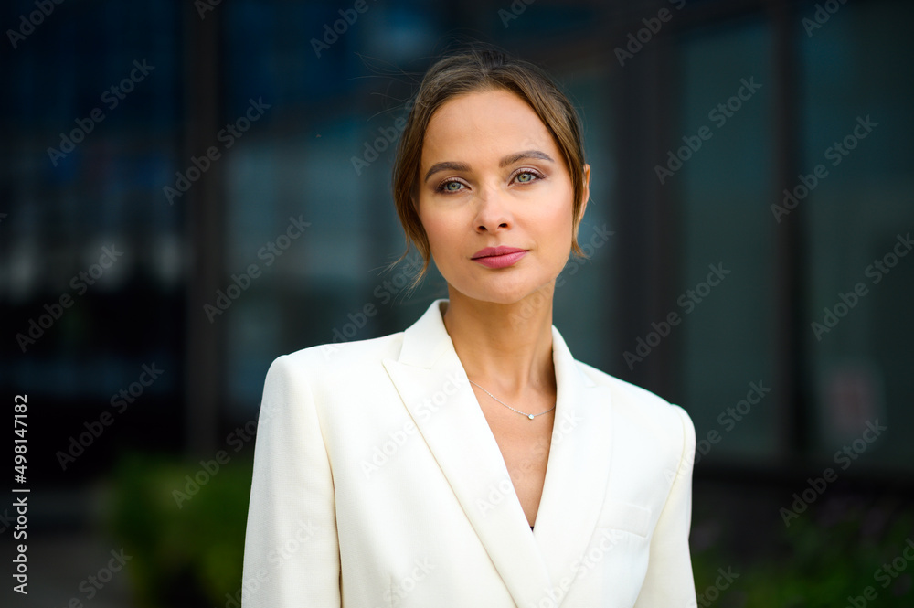 Confident young female manager outdoor in a modern urban setting Confident young female manager outdoor in a modern urban setting