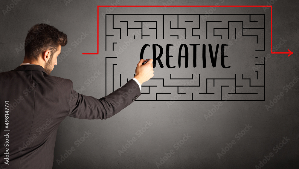 businessman drawing maze concept businessman drawing maze concept