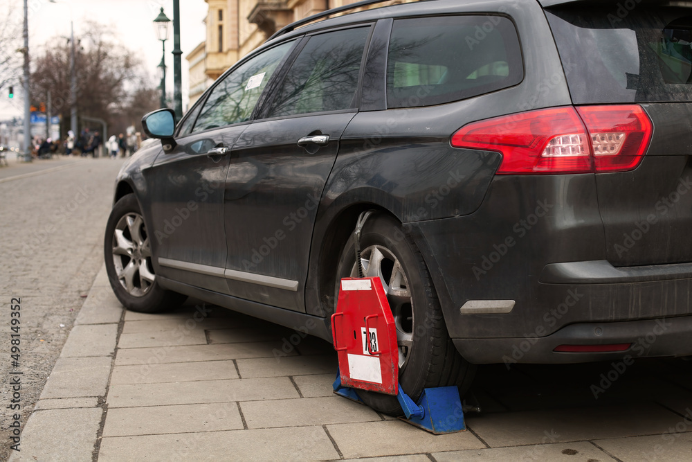 Car wheel clamp Locked illegally parked cars Car wheel blocked by wheel