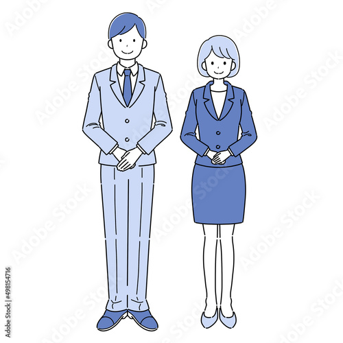 スーツを着て並ぶ男女